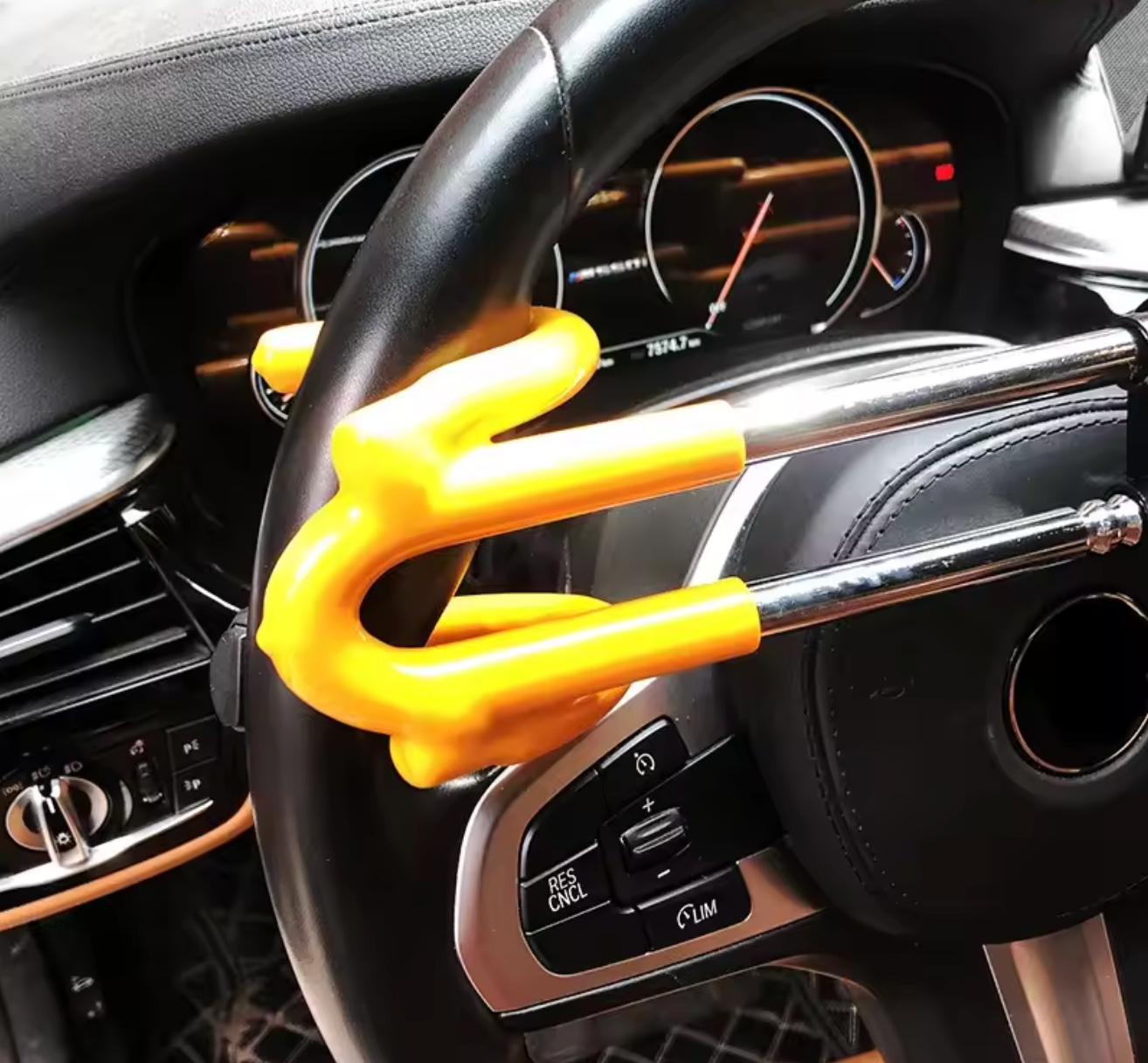 Yellow steering wheel lock on a car steering wheel
