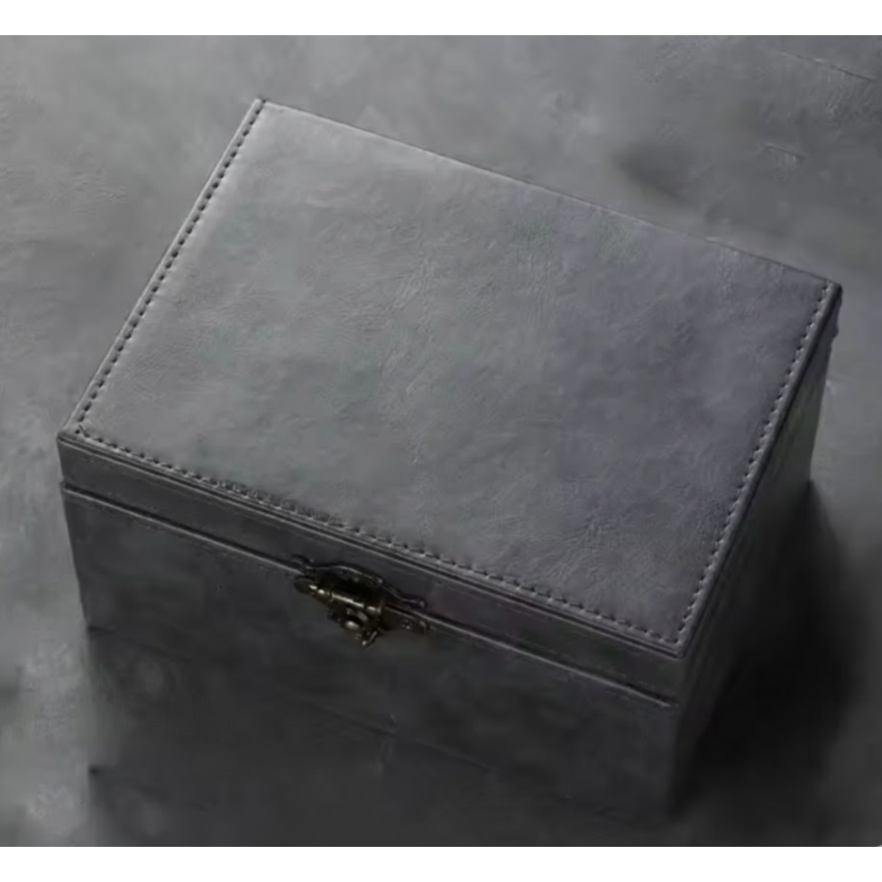 Grey signal locking faraday box used to prevent relay theft by blocking key signals with a clasp on a grey background