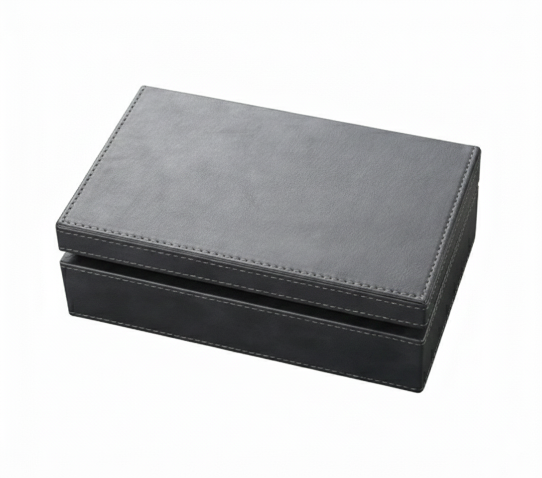 Black leather signal blocking Faraday boxes that prevent car theft by blocking signal cloning relay attacks on a white background